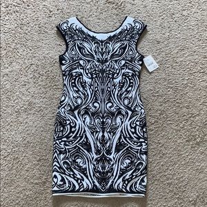 Never worn BLACK AND WHITE dress. Value: $475